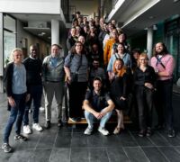 Full group of NAFAns in stairwell at Max Planck Institutes, Jena